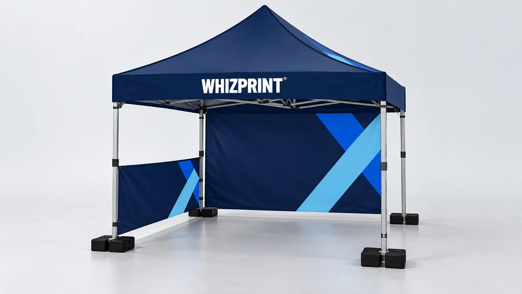 Illustrative navy Whizprint gazebo with an open front, a half-height side wall and a full rear wall, supported by leg weights on a studio floor.